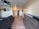 Living room with grey couch and wood-look floors at 5945 21St N St # 14, St Petersburg, FL 33714