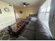 Living room with a grey sectional and coffee table at 5945 21St N St # 14, St Petersburg, FL 33714