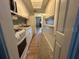 Long kitchen with ample counter space and white cabinets at 5945 21St N St # 14, St Petersburg, FL 33714