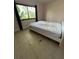 Bedroom with large bed and window at 5122 Lillilea Ln, New Port Richey, FL 34653