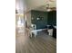 Living room with dark green and gray walls, laminate flooring at 5122 Lillilea Ln, New Port Richey, FL 34653