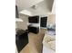 Bright kitchen features dark wood cabinets and granite countertops at 5122 Lillilea Ln, New Port Richey, FL 34653