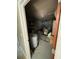 Interior view of garage with water heater and storage items at 5122 Lillilea Ln, New Port Richey, FL 34653