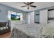 Main bedroom with king-size bed, white dresser, and access to laundry at 11200 Walsingham Rd # 124, Largo, FL 33778