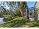 Screened patio overlooking lake at 1211 Penny Ct, Dunedin, FL 34698