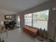 Bright dining area with ample natural light, a dining table set, and sliding glass doors to the outside at 12907 Wildflower Meadow Dr, Riverview, FL 33579