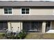 Home's backyard with screened patio and AC units at 17399 Nectar Flume Dr, Land O Lakes, FL 34638