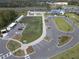 Aerial view of community farm, parking lot, and building at 17399 Nectar Flume Dr, Land O Lakes, FL 34638