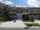 Three-unit townhouse building with driveway parking at 17399 Nectar Flume Dr, Land O Lakes, FL 34638