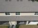 Aerial view showing house rear, screened patio, and AC units at 17399 Nectar Flume Dr, Land O Lakes, FL 34638