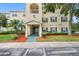 Charming condominium exterior with landscaped grounds, convenient parking, and inviting entrance at 18593 Bridle Club Dr, Tampa, FL 33647