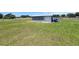 Exterior shot showcasing a utility shed in the spacious backyard at 5302 Turkey Creek Rd, Plant City, FL 33567