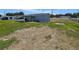 Home's expansive backyard, offering ample space and featuring a covered patio, great for outdoor relaxation at 5302 Turkey Creek Rd, Plant City, FL 33567