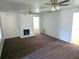 Bright Living Room features a decorative fireplace and neutral carpeting at 5302 Turkey Creek Rd, Plant City, FL 33567