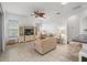Living room with neutral decor and access to a lanai at 10211 Cleghorn Dr, San Antonio, FL 33576