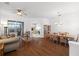 Open living and dining area with hardwood floors and large windows at 10211 Cleghorn Dr, San Antonio, FL 33576