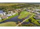 Aerial view highlighting home's location by golf course at 10211 Cleghorn Dr, San Antonio, FL 33576