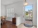 Bright entryway with hardwood floors, white walls, and a view of the backyard at 10211 Cleghorn Dr, San Antonio, FL 33576