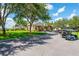 Community clubhouse with golf cart parking and entrance at 10211 Cleghorn Dr, San Antonio, FL 33576