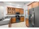Updated kitchen with wood cabinets and granite counters at 10211 Cleghorn Dr, San Antonio, FL 33576