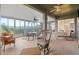 Relaxing screened porch with seating and dining areas at 10211 Cleghorn Dr, San Antonio, FL 33576