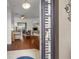 Entryway with view into living room, hardwood floors, and a ceiling fan at 10211 Cleghorn Dr, San Antonio, FL 33576