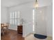 Entryway with hardwood floors, white walls, and plantation shutters at 10211 Cleghorn Dr, San Antonio, FL 33576
