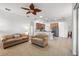 Spacious living room with kitchen views and a lanai at 10211 Cleghorn Dr, San Antonio, FL 33576