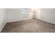 Spacious bedroom with neutral carpeting and ample natural light at 3510 Allandale Dr, Holiday, FL 34691