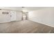 Spacious living room with neutral carpeting and large windows at 3510 Allandale Dr, Holiday, FL 34691