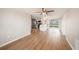 Open living room with wood-looking floor, and access to backyard at 3510 Allandale Dr, Holiday, FL 34691