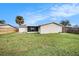 Large backyard with grassy area and privacy fence at 3510 Allandale Dr, Holiday, FL 34691