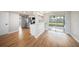 Light and bright dining area with wood-look flooring and access to the backyard at 3510 Allandale Dr, Holiday, FL 34691