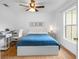 Bright bedroom with a comfortable bed, workspace, and plenty of natural light at 18593 Bridle Club Dr, Tampa, FL 33647