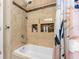 Updated bathroom with a tub and shower, built-in shelves, and stylish shower curtain at 18593 Bridle Club Dr, Tampa, FL 33647