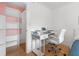 Home office with a desk and chair, built into a bedroom closet at 18593 Bridle Club Dr, Tampa, FL 33647