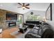 Living room with sectional sofa and stone fireplace at 18593 Bridle Club Dr, Tampa, FL 33647