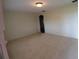 Spacious bedroom with carpet flooring and an arched doorway at 5302 Turkey Creek Rd, Plant City, FL 33567