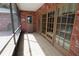 Screened porch with brick flooring and sliding glass doors at 5302 Turkey Creek Rd, Plant City, FL 33567
