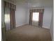 Large bedroom featuring neutral walls, carpet, and ceiling fan at 5302 Turkey Creek Rd, Plant City, FL 33567