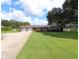 Brick ranch home with two-car garage and spacious lawn at 5302 Turkey Creek Rd, Plant City, FL 33567