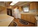 Bright kitchen features wood cabinets, white appliances, and light countertops at 5302 Turkey Creek Rd, Plant City, FL 33567