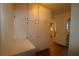Hallway with built-in storage cabinets and wood-look flooring at 5302 Turkey Creek Rd, Plant City, FL 33567