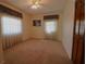 Spacious bedroom with neutral carpeting and ample natural light at 5302 Turkey Creek Rd, Plant City, FL 33567