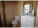 Updated half bathroom with white vanity and marble countertop at 5302 Turkey Creek Rd, Plant City, FL 33567