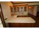 Wet bar with wood cabinets and a light-colored countertop at 5302 Turkey Creek Rd, Plant City, FL 33567