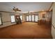Gathering room with wet bar, built-ins and sliding glass doors at 5302 Turkey Creek Rd, Plant City, FL 33567