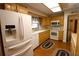Kitchen with wood cabinets, white appliances, and laminate countertops at 5302 Turkey Creek Rd, Plant City, FL 33567