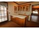 Wet bar with wood cabinets and a light-colored countertop at 5302 Turkey Creek Rd, Plant City, FL 33567
