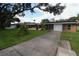 Long driveway leading to a home with a detached garage and pool at 5302 Turkey Creek Rd, Plant City, FL 33567